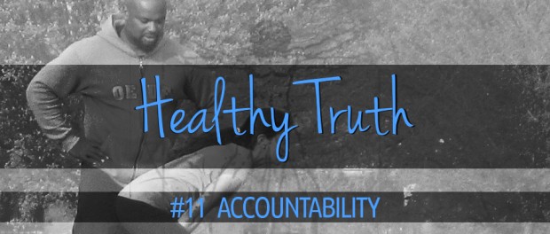 Healthy Truth - Accountability personal trainer guiding client through kettlebell swings